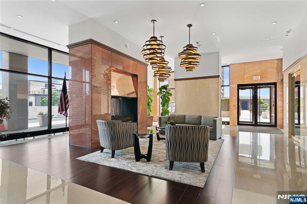 200 Old Palisade Road, Unit 21J Fort Lee, NJ 07024 - Photo 3 of 29 a view of dinning table and chairs in a room
