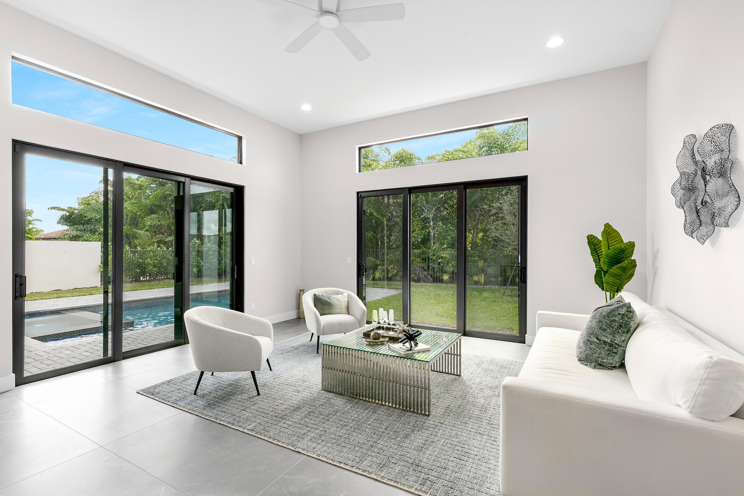 9132 Benedetta Place Boca Raton, FL 33496 - Photo 17 of 50 a living room with furniture and a large window