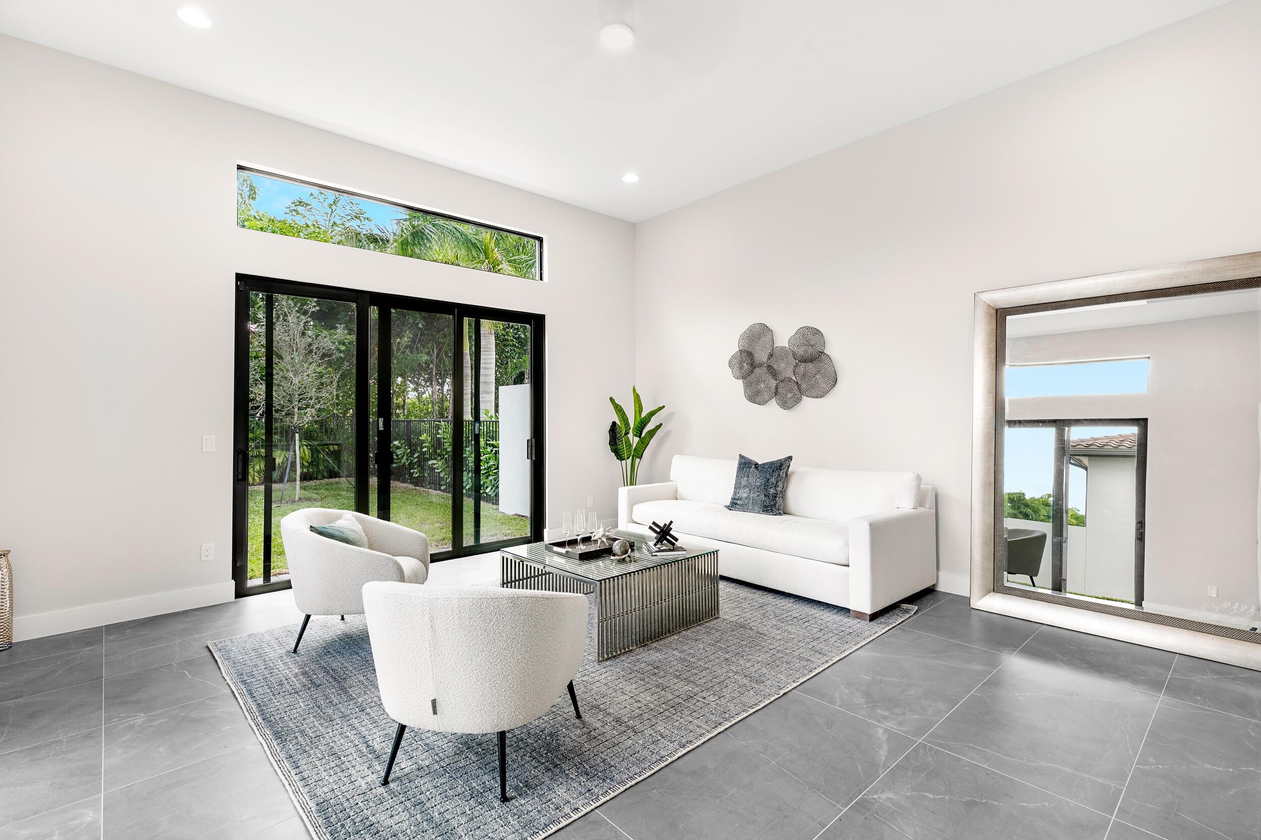 9132 Benedetta Place Boca Raton, FL 33496 - Photo 18 of 50 a living room with furniture and a large window