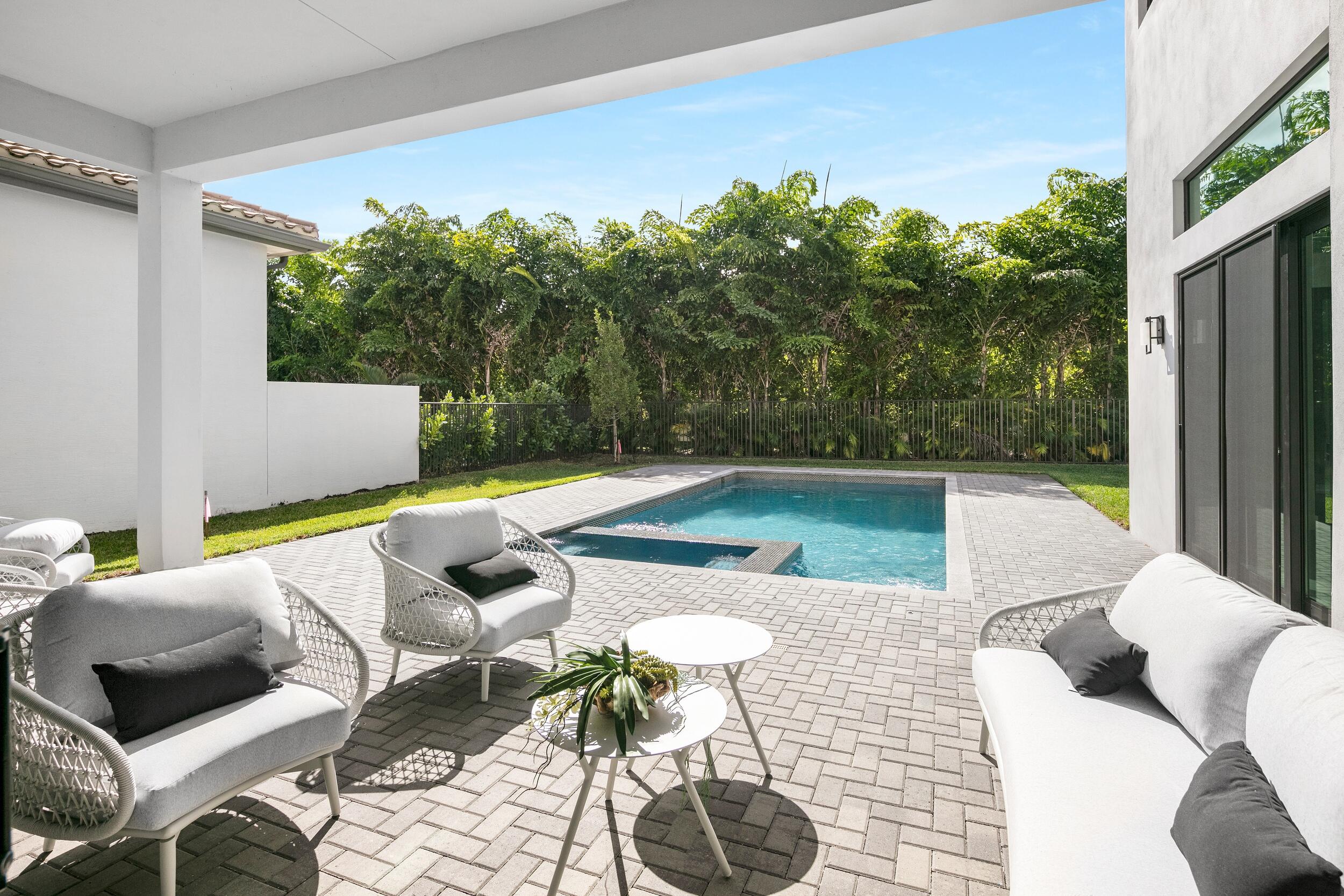 9132 Benedetta Place Boca Raton, FL 33496 - Photo 21 of 50 a view of swimming pool with seating space