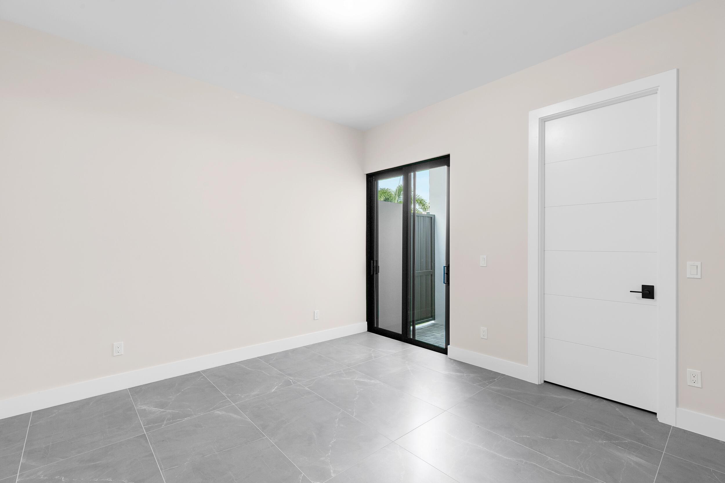 9132 Benedetta Place Boca Raton, FL 33496 - Photo 27 of 50 an empty room with closet and a bathroom