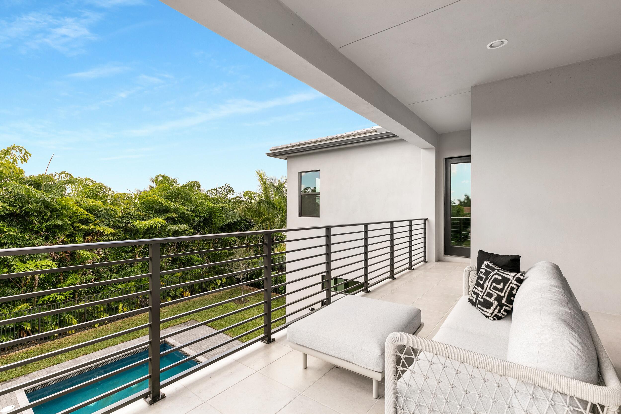 9132 Benedetta Place Boca Raton, FL 33496 - Photo 39 of 50 a view of a roof deck with couches and sky view
