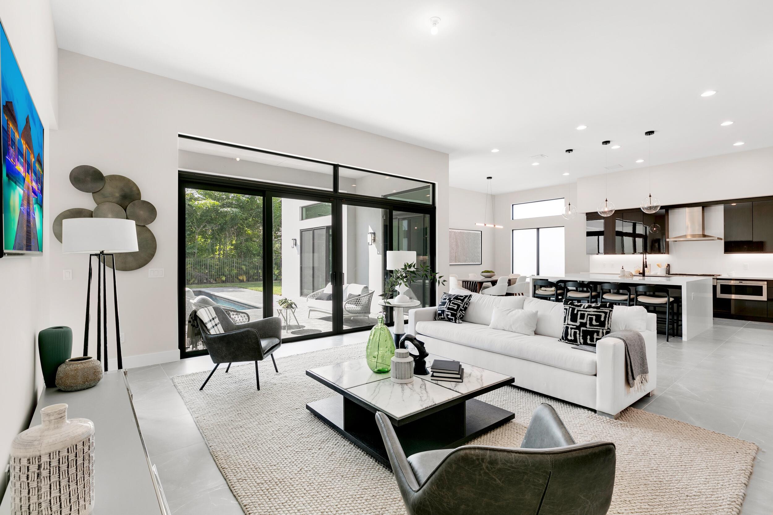 9132 Benedetta Place Boca Raton, FL 33496 - Photo 8 of 50 a living room with furniture and a large window