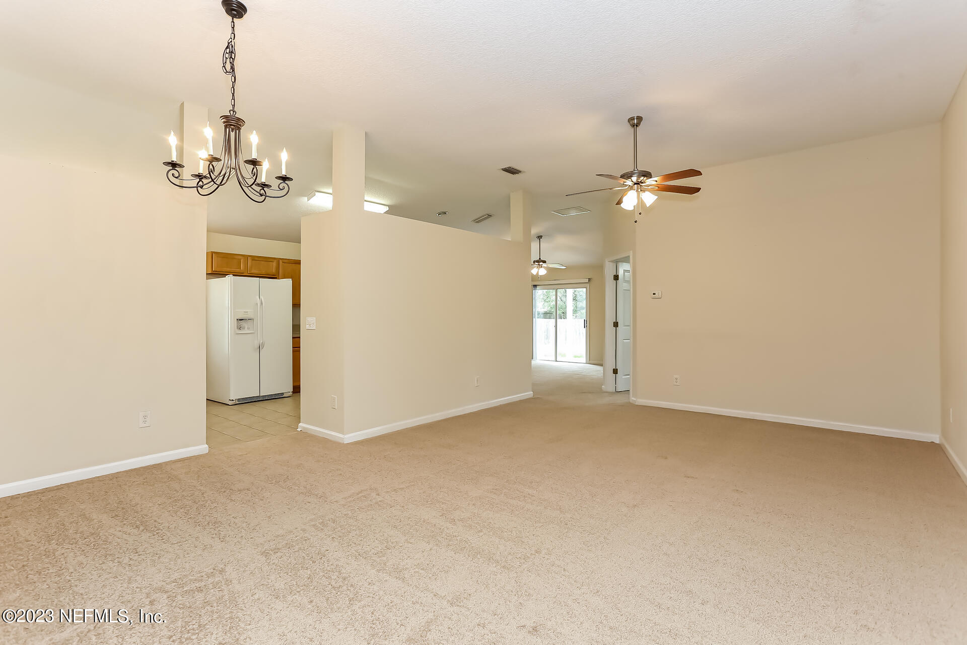 11739 Raindrop Road Jacksonville, FL 32219 - Photo 16 of 19 a view of a livingroom with a chandelier