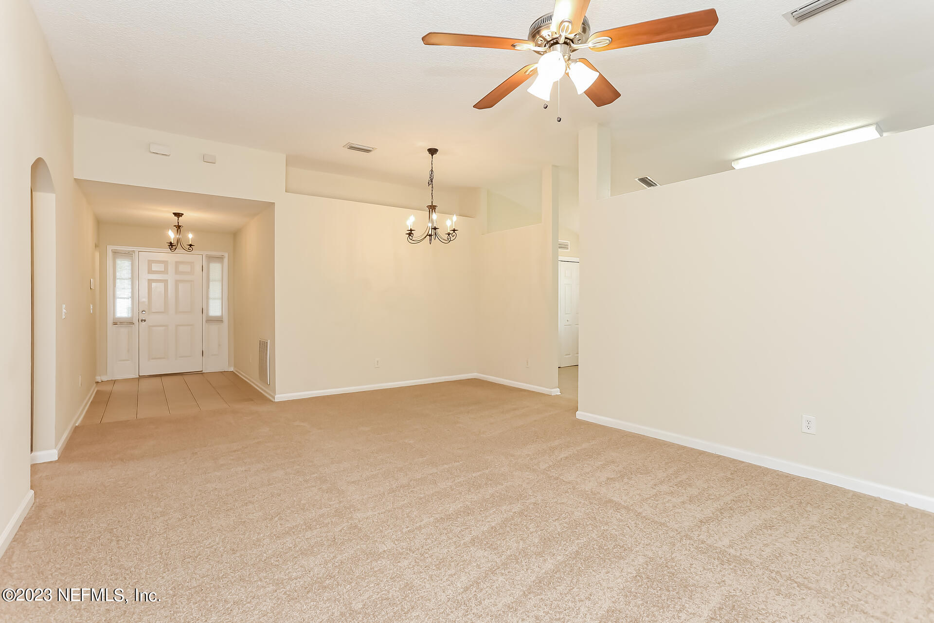 11739 Raindrop Road Jacksonville, FL 32219 - Photo 18 of 19 en empty room with closet and a chandelier fan