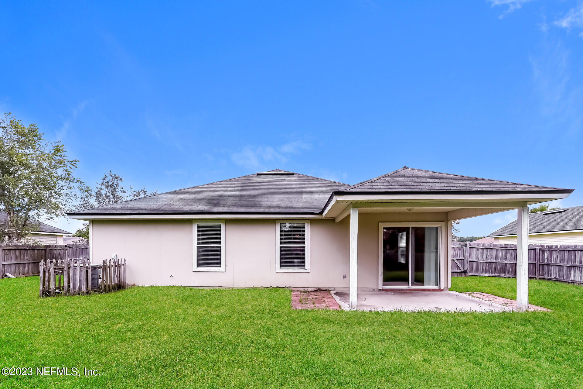 11739 Raindrop Road Jacksonville, FL 32219 - Photo 3 of 19 front view of a house with a yard