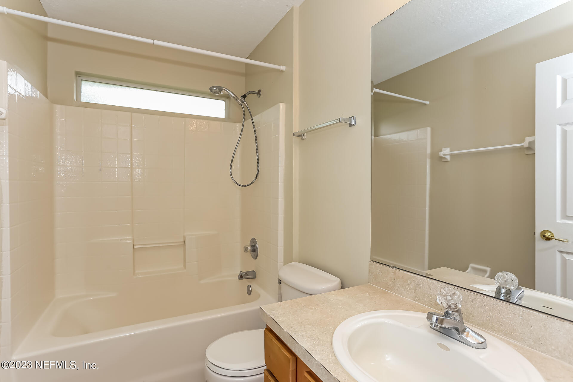 11739 Raindrop Road Jacksonville, FL 32219 - Photo 4 of 19 a bathroom with a sink toilet and shower