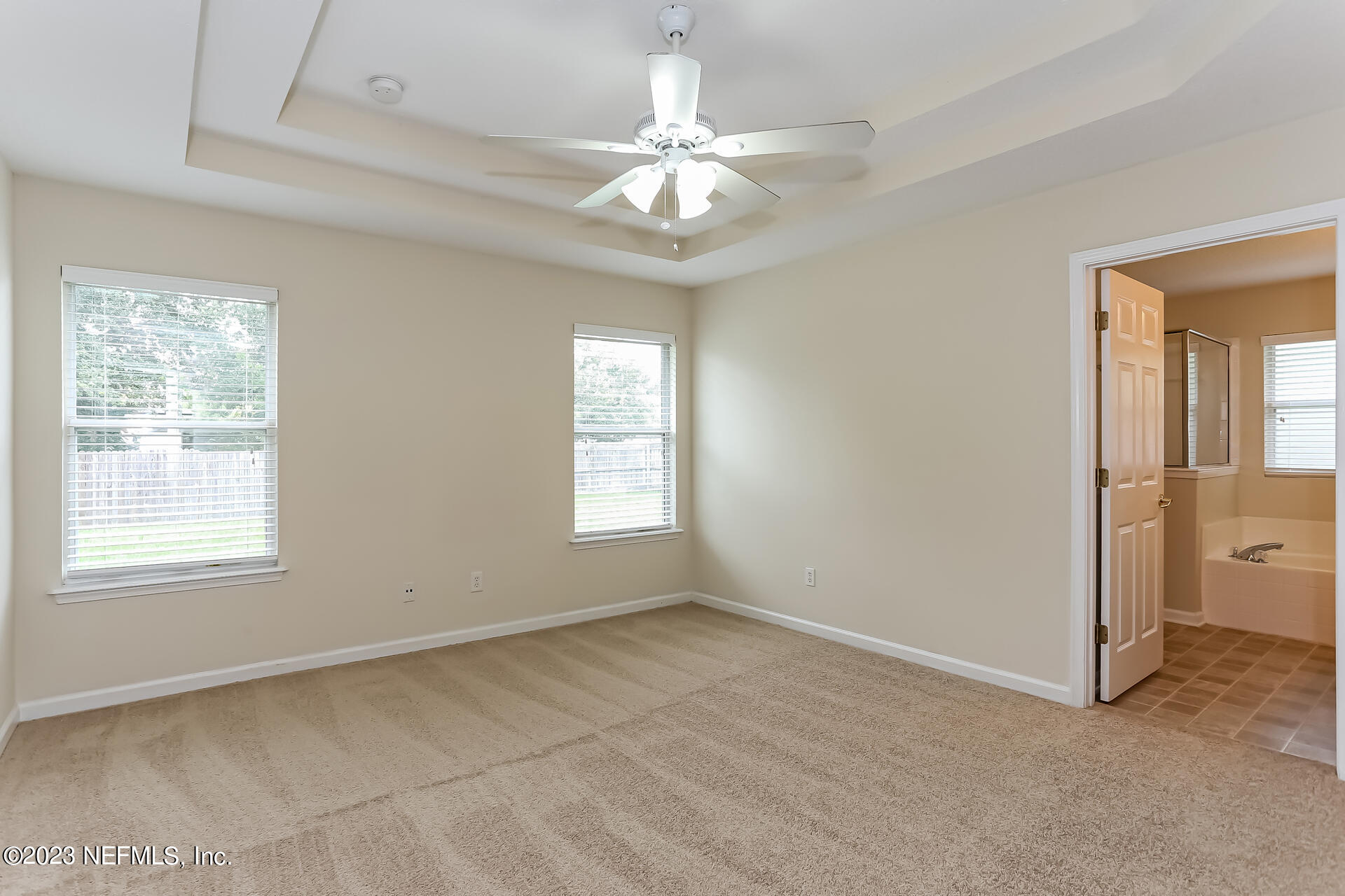 11739 Raindrop Road Jacksonville, FL 32219 - Photo 9 of 19 a view of an empty room with a window