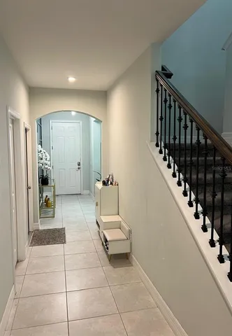 a view of a hallway with a furniture and stairs