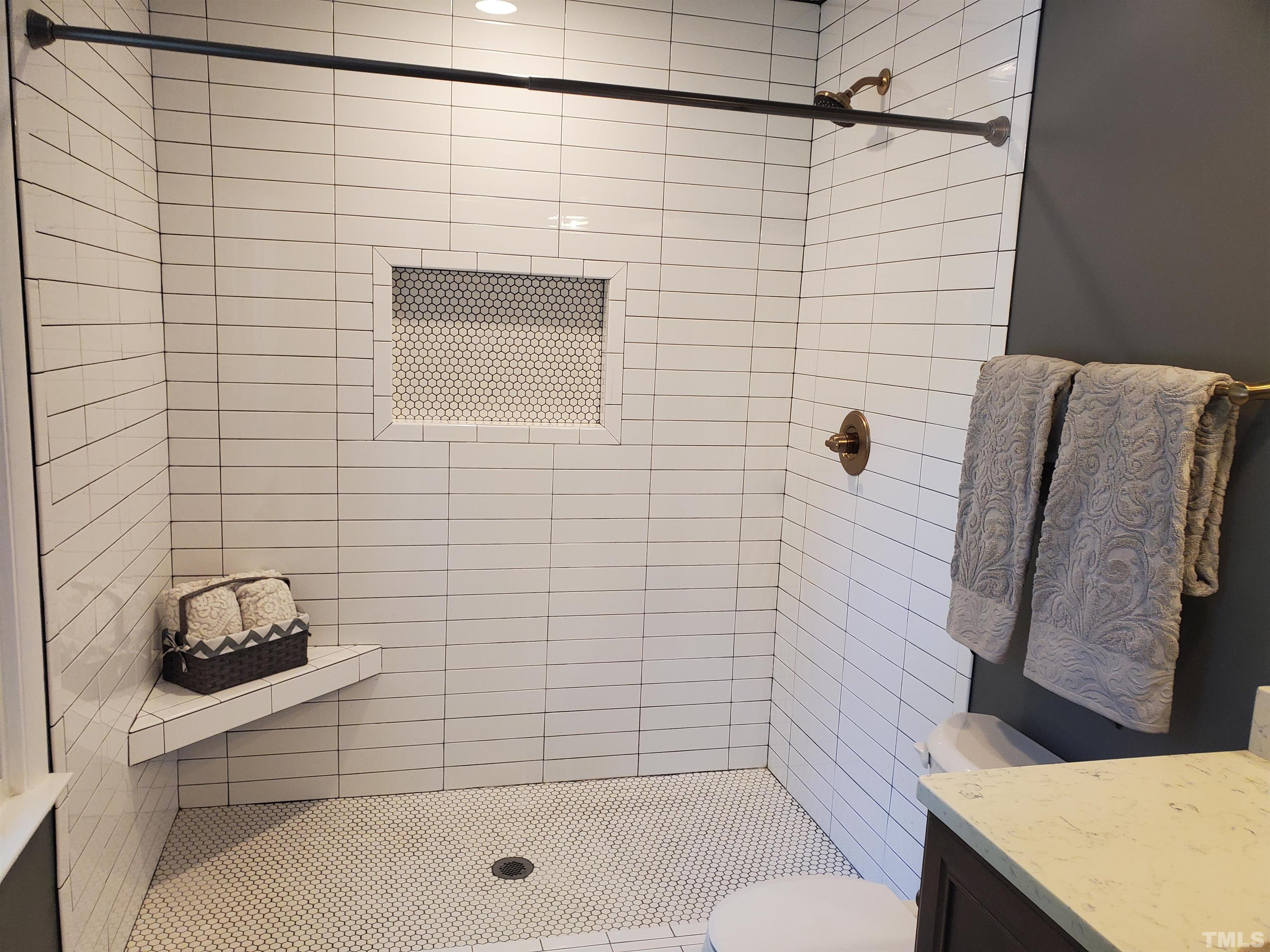 2006 Myron Drive Raleigh, NC 27607 - Photo 14 of 28 a bathroom with a shower toilet and sink