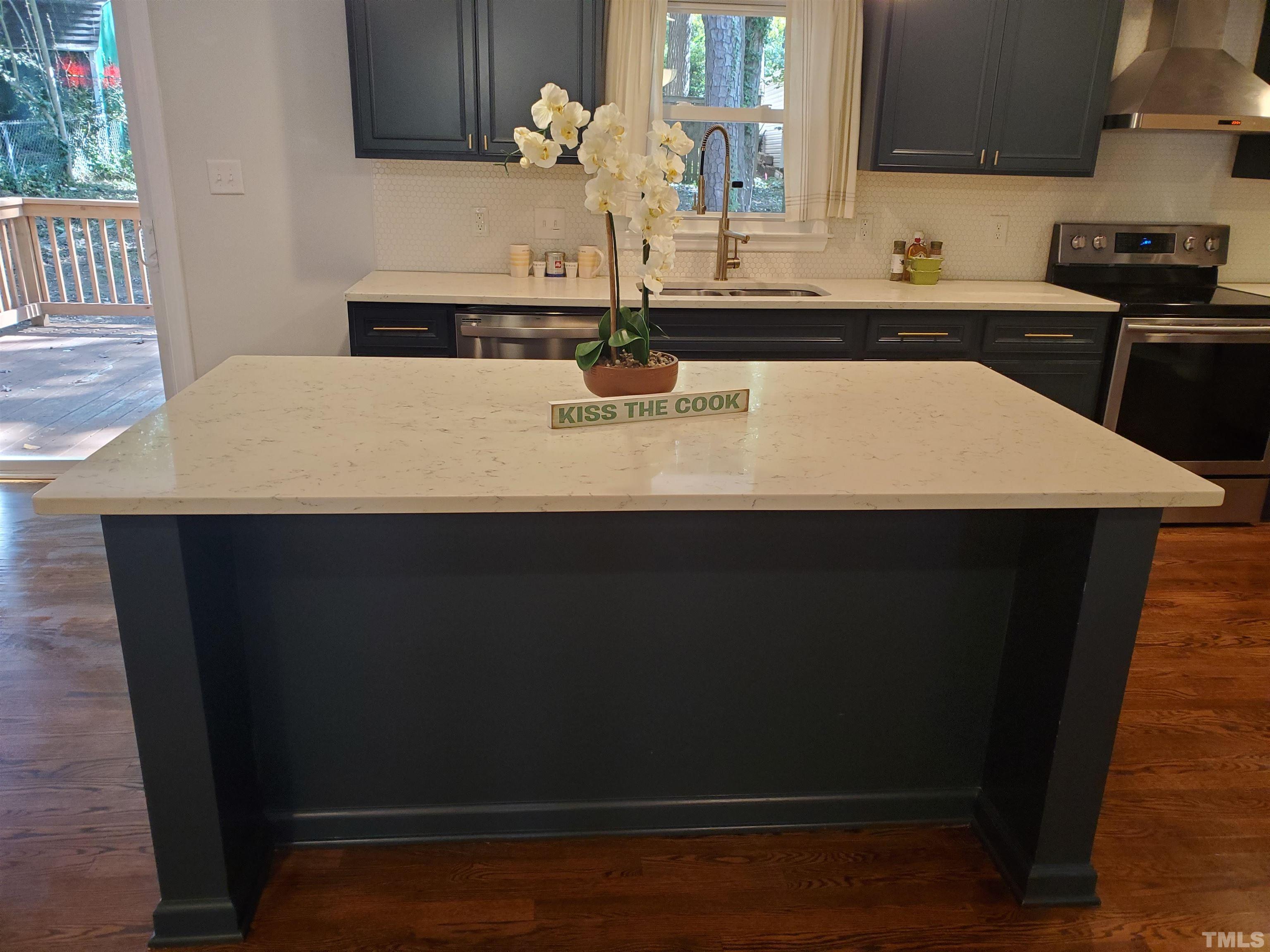 2006 Myron Drive Raleigh, NC 27607 - Photo 5 of 28 a kitchen with a sink and wooden floor