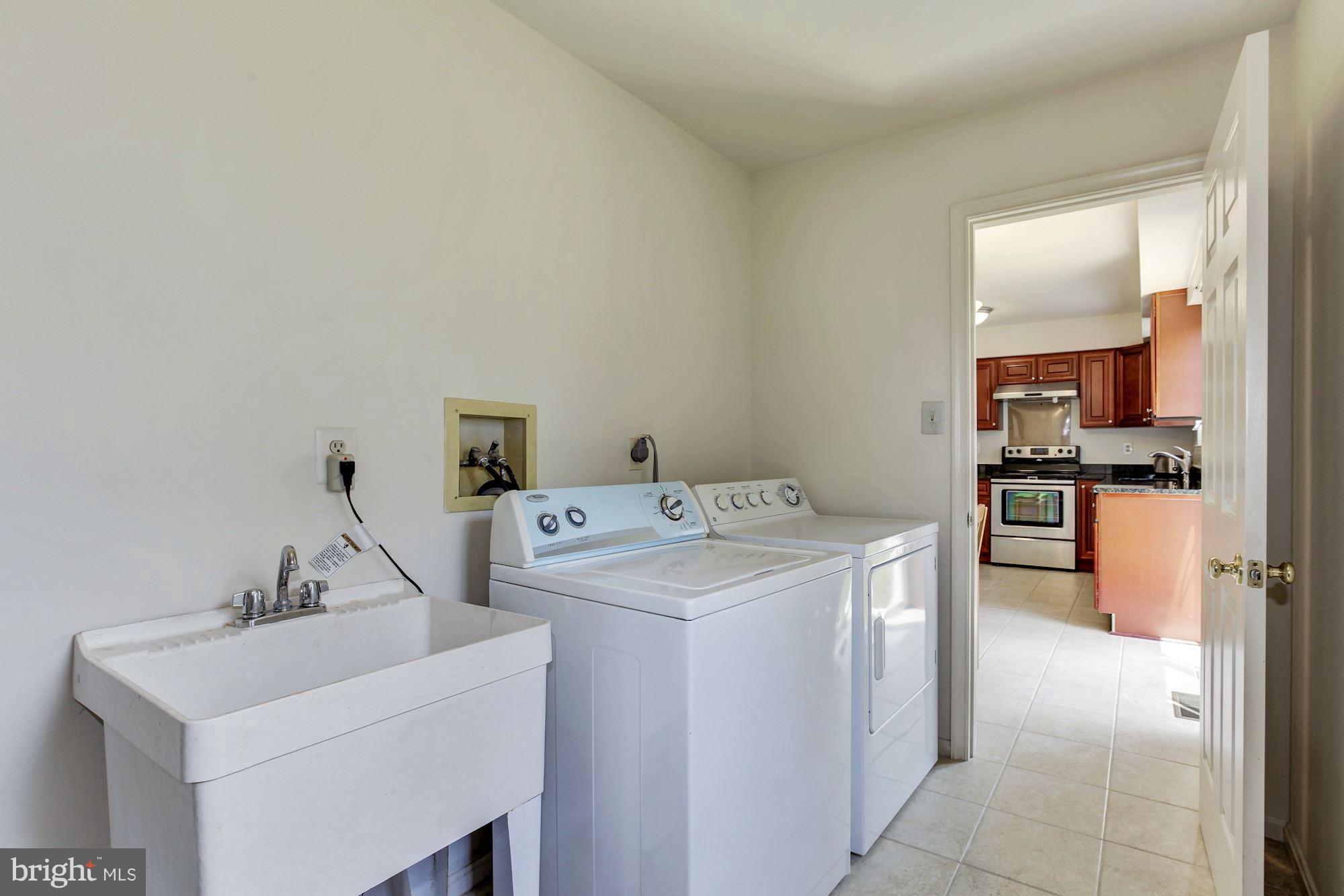1611 Spottsworth Way Silver Spring, MD 20905 - Photo 7 of 30 Laundry room off kitchen, newer w/d