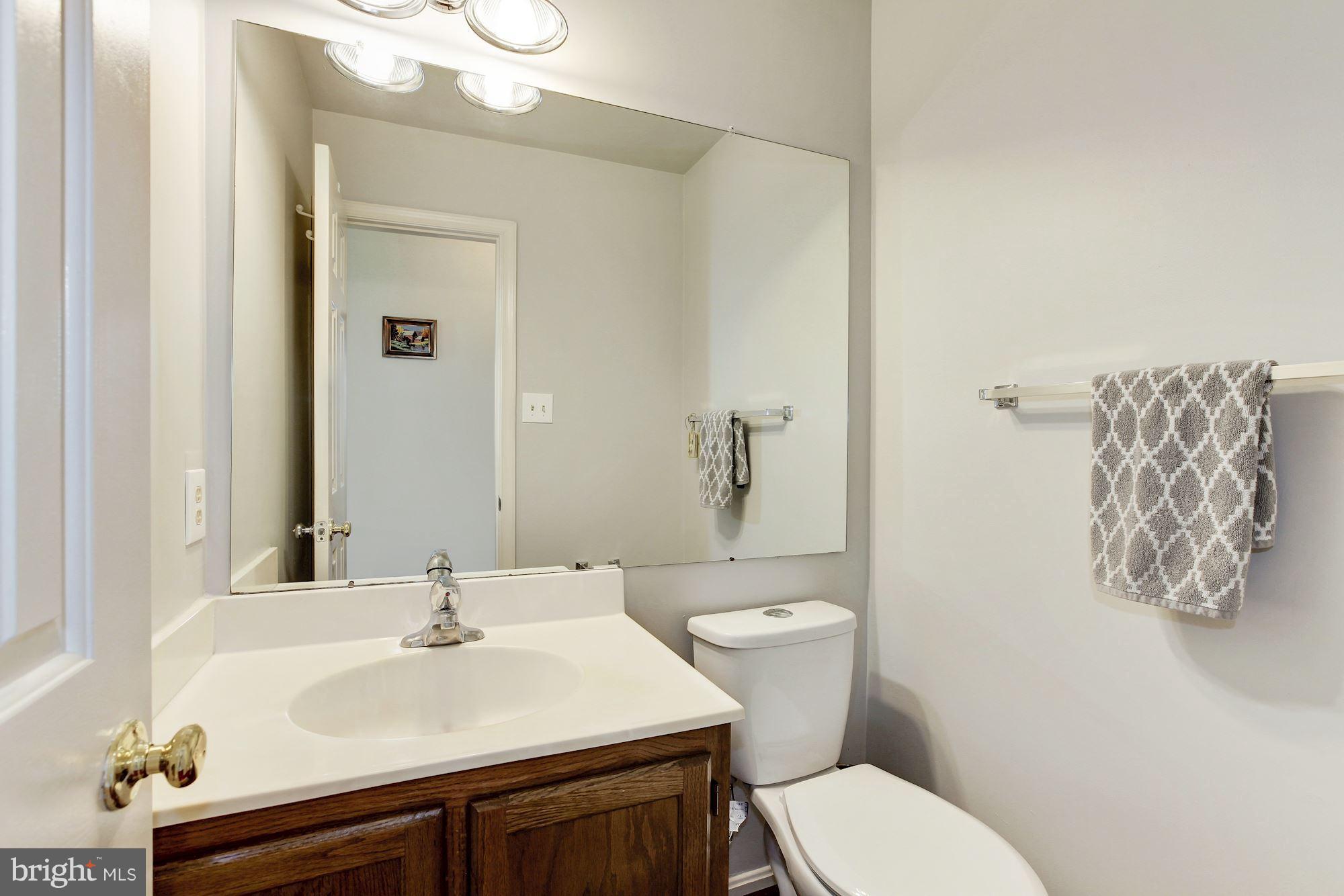 1611 Spottsworth Way Silver Spring, MD 20905 - Photo 8 of 30 Half bath off center hall