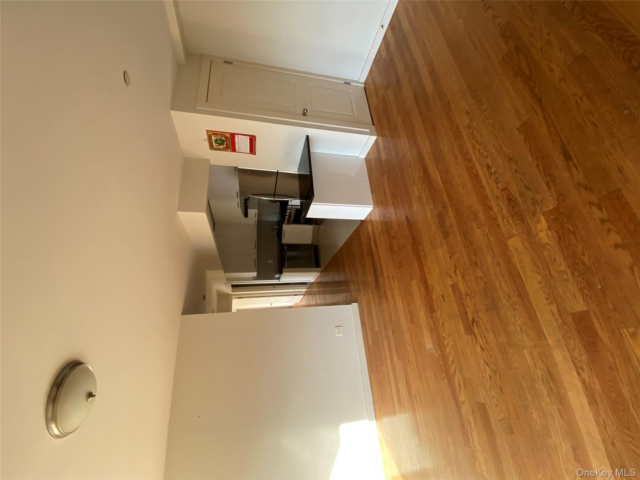 132-35 41st Road, Unit 10D Queens, NY 11355 - Photo 6 of 18 a view of kitchen and empty room