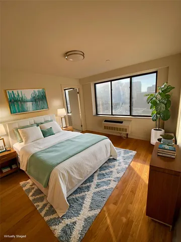 a view of a room with gym equipment and a large window