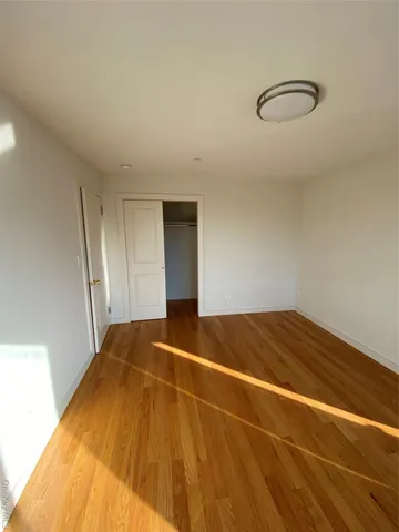 a bedroom with furniture and a large window