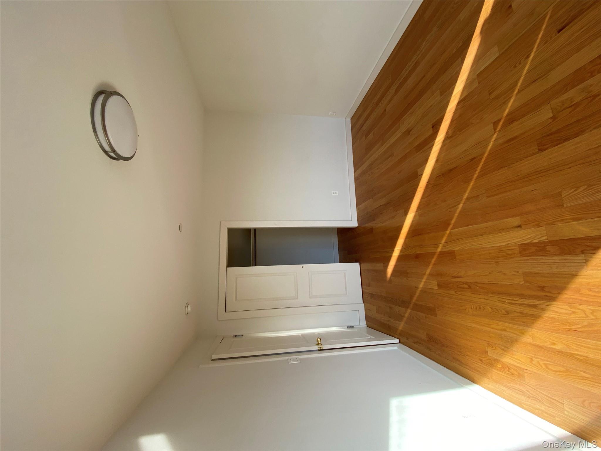 132-35 41st Road, Unit 10D Queens, NY 11355 - Photo 10 of 18 a bedroom with a bed and a painting on the wall