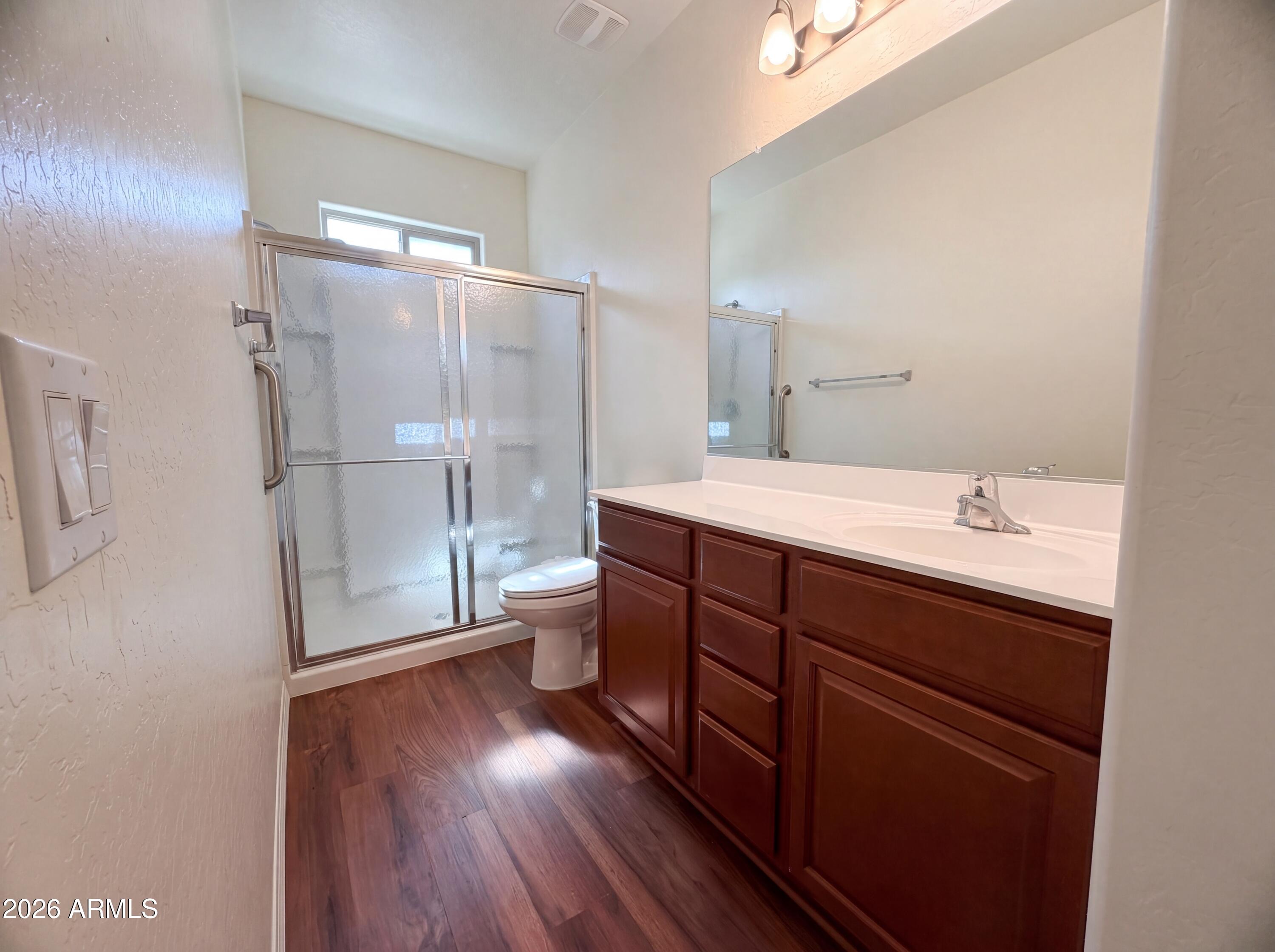 1738 South Aryelle Road Apache Junction, AZ 85119 - Photo 14 of 17 a spacious bathroom with a double vanity sink toilet and shower