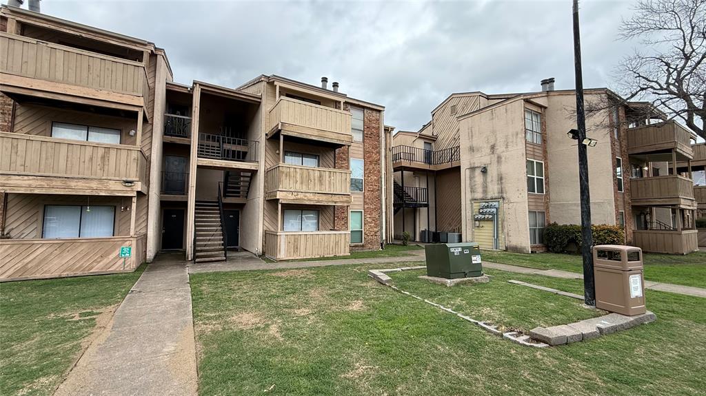 8110 Skillman Street, Unit 1046 Dallas, TX 75231 - Photo 1 of 10 a front view of a house with a yard
