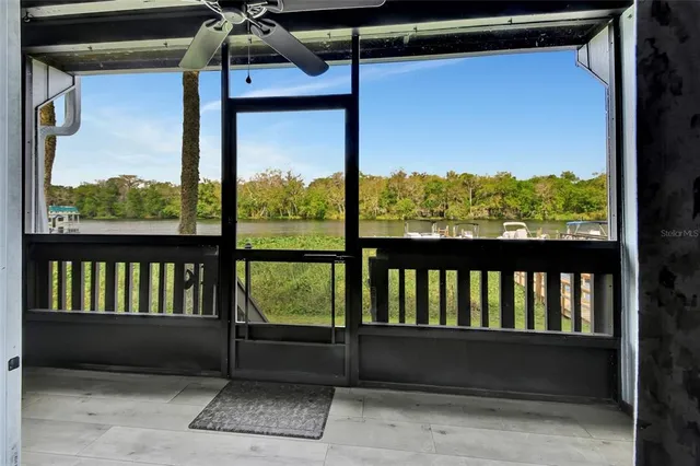 a view of a balcony with furniture