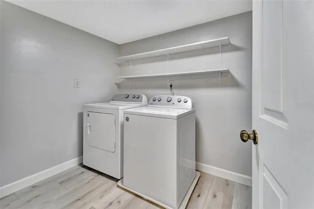 a utility room with dryer and washer