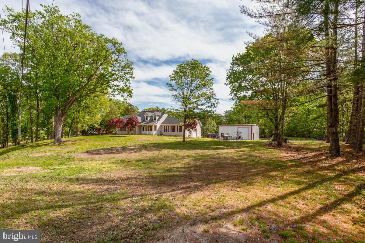 400 Adelina Road Prince Frederick, MD 20678 - Photo 11 of 57 Serene home nestled in lush greenery.