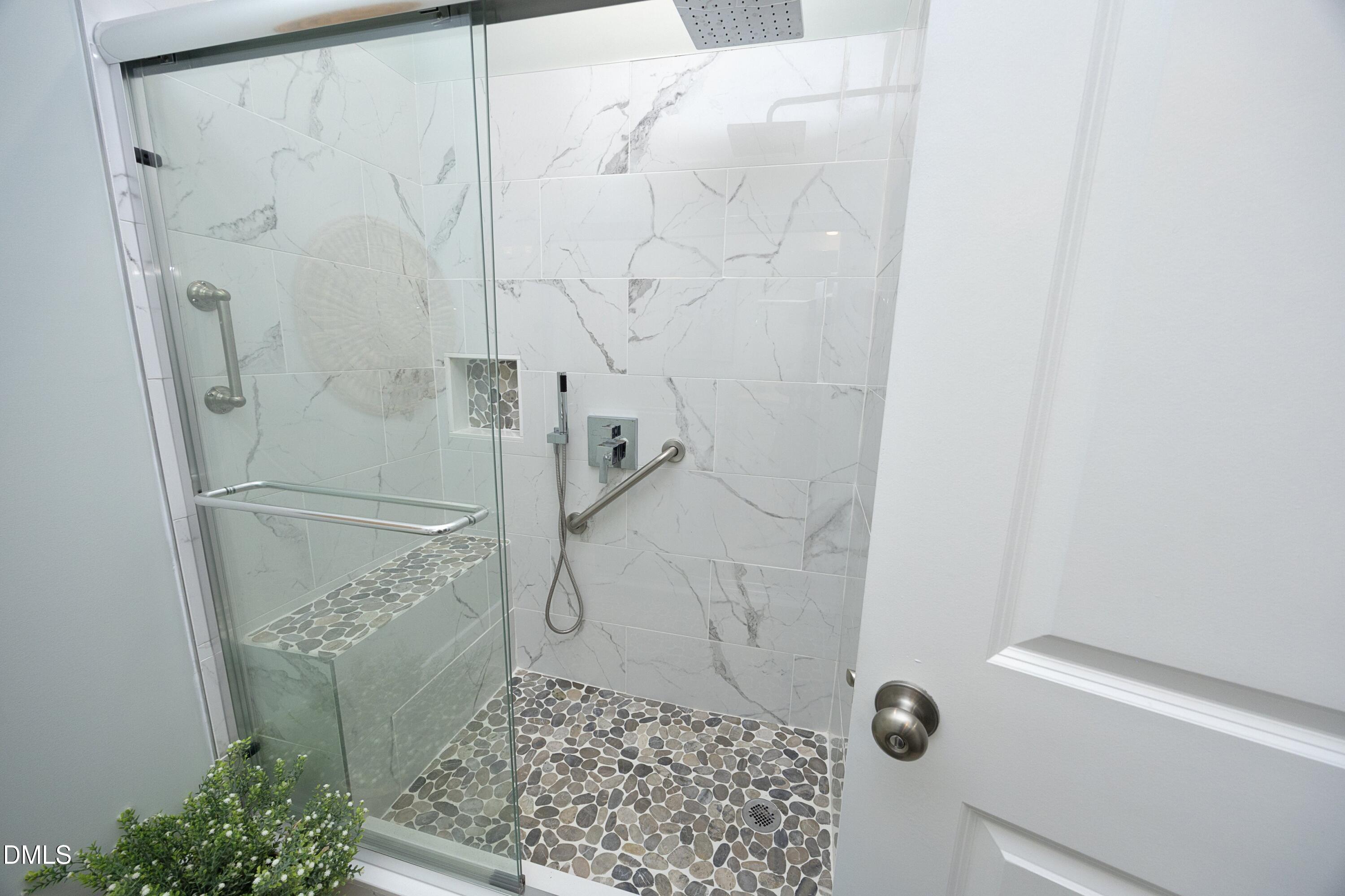 91 Kitty Br Way Clayton, NC 27520 - Photo 27 of 51 a bathroom with a shower