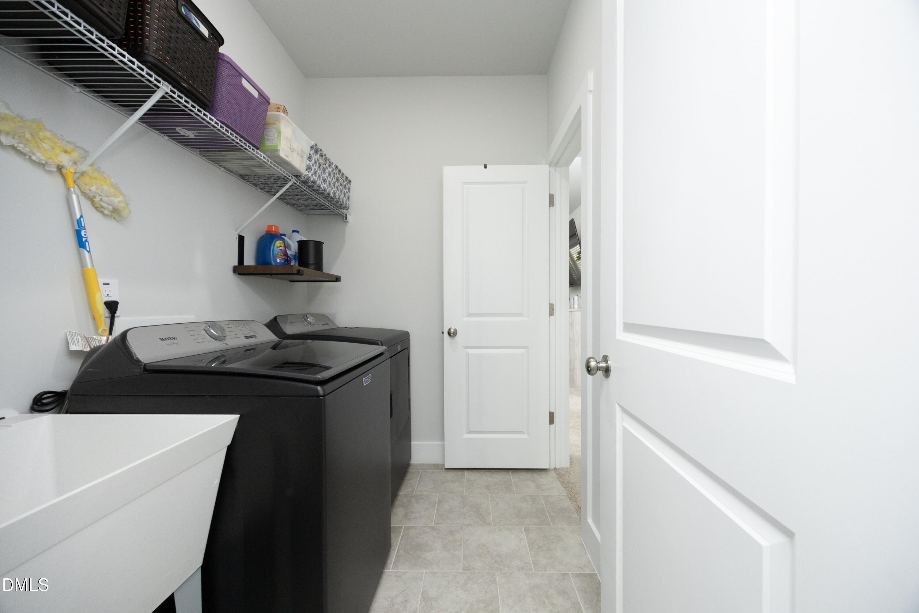 91 Kitty Br Way Clayton, NC 27520 - Photo 28 of 51 a kitchen with a sink and cabinets