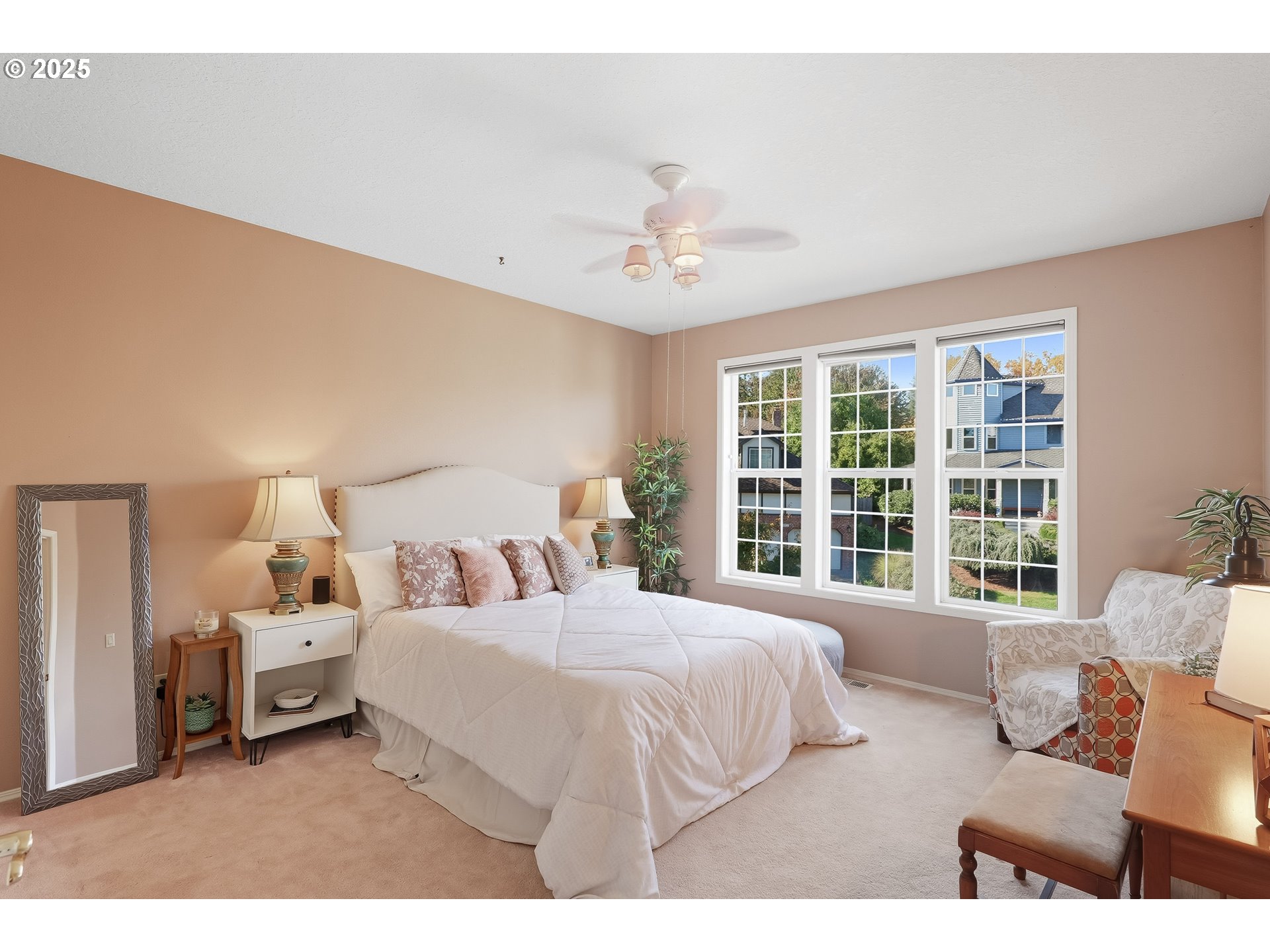 14362 Southwest 134th Drive Portland, OR 97224 - Photo 18 of 36 a bedroom with a large bed and a large window