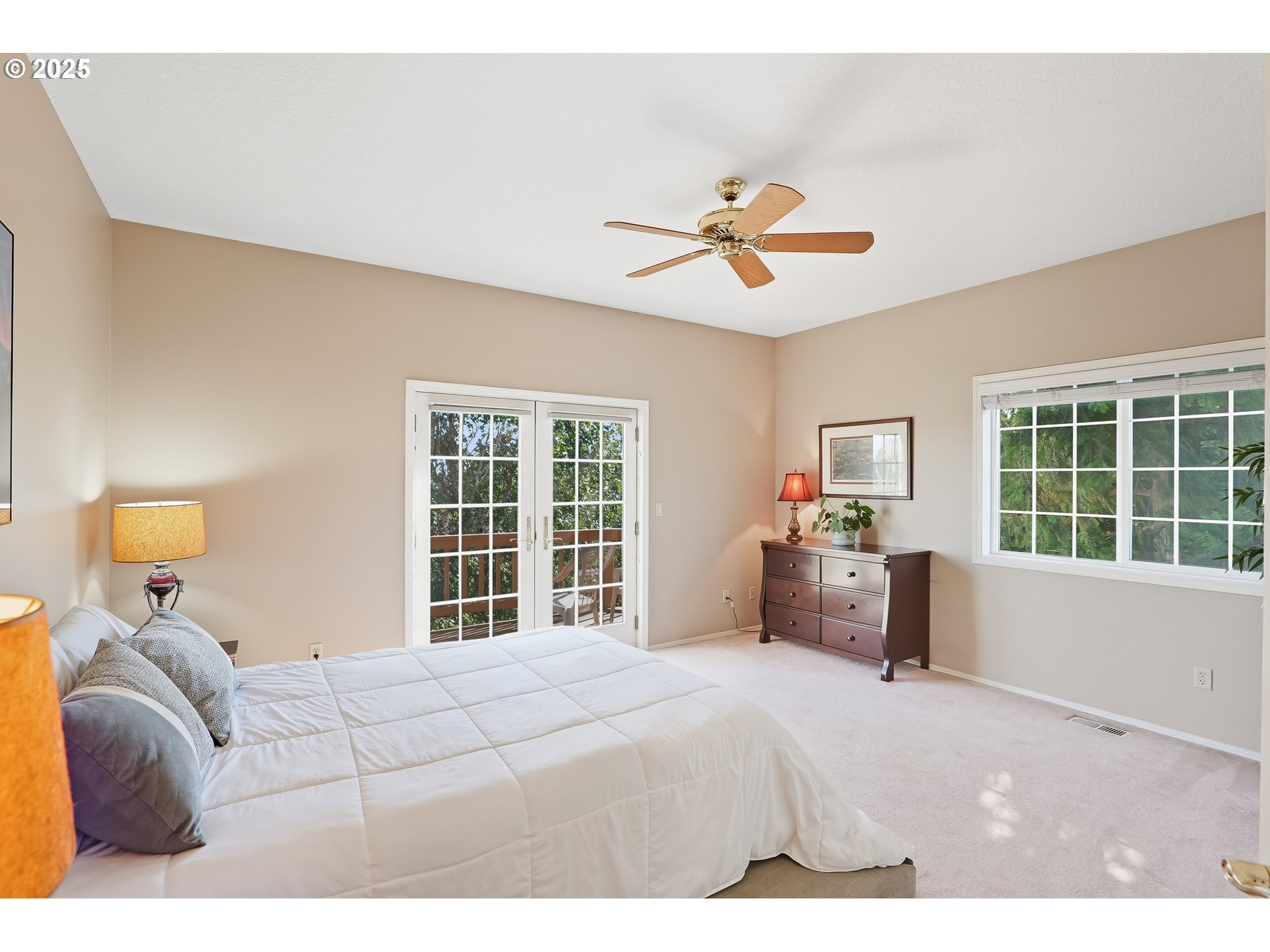 14362 Southwest 134th Drive Portland, OR 97224 - Photo 19 of 36 a bedroom with a bed and a large window