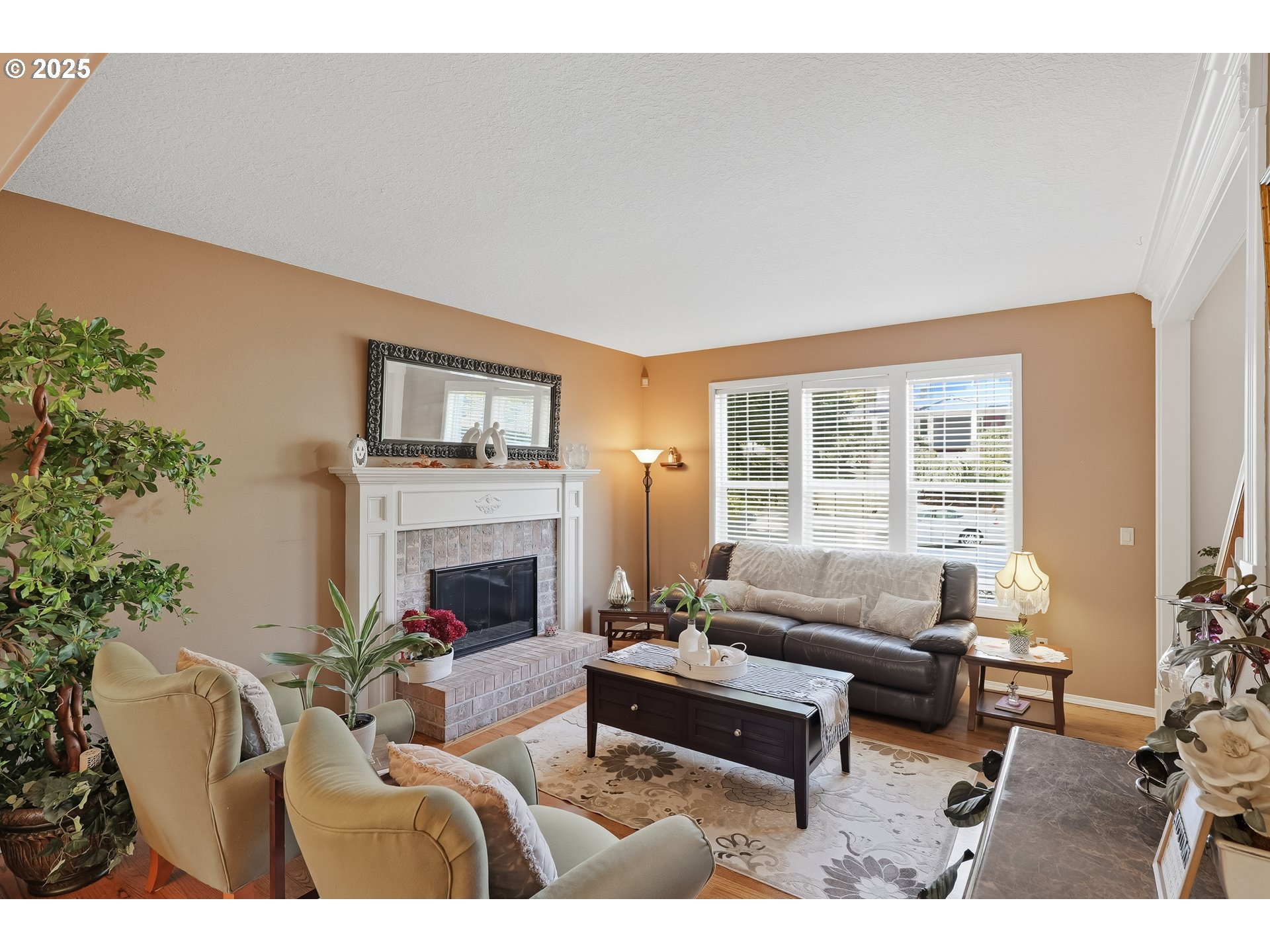 14362 Southwest 134th Drive Portland, OR 97224 - Photo 5 of 36 a living room with furniture and a fireplace