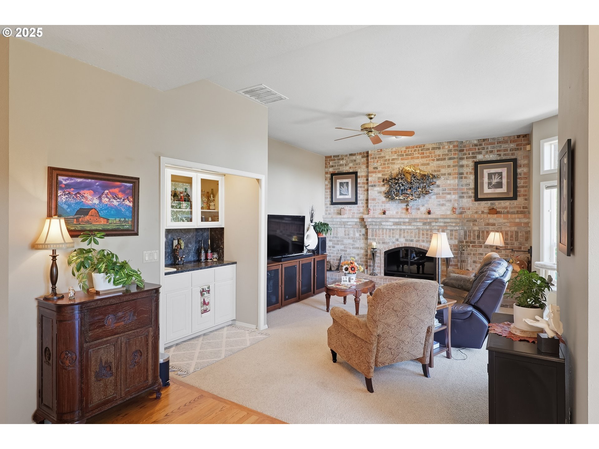 14362 Southwest 134th Drive Portland, OR 97224 - Photo 10 of 36 a living room with furniture a fireplace and a flat screen tv