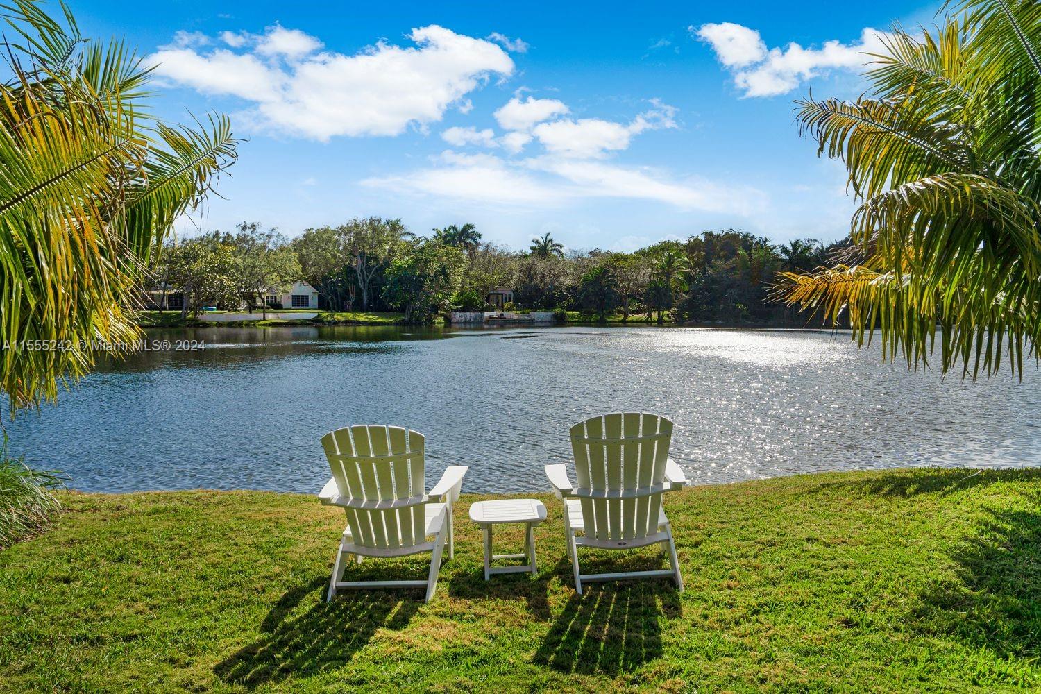 a view of a lake with furniture