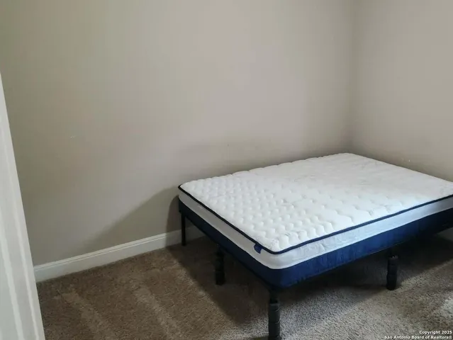 a bed sitting in a room