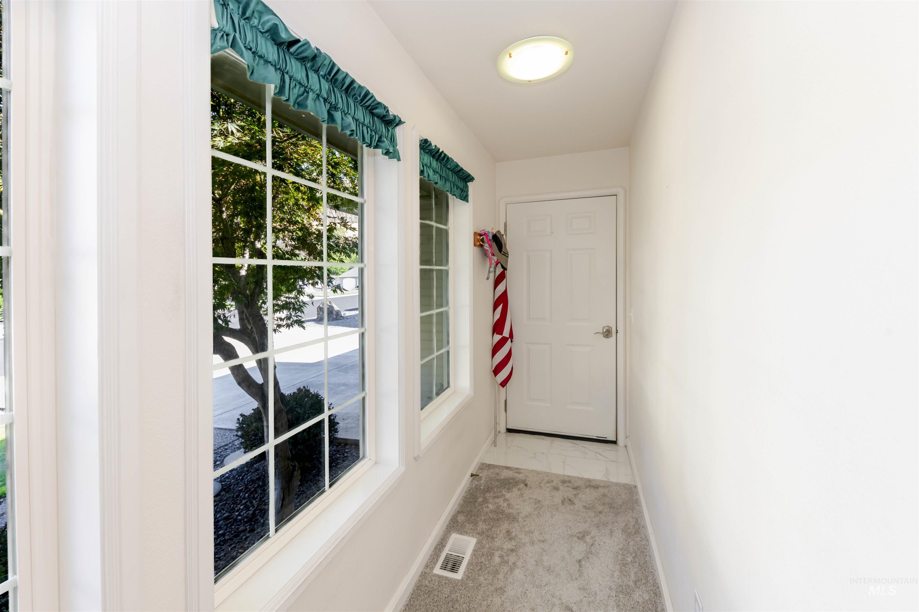 331 Reservoir Drive Lewiston, ID 83501 - Photo 18 of 42 Doorway to outside with baseboards and marble finish floors