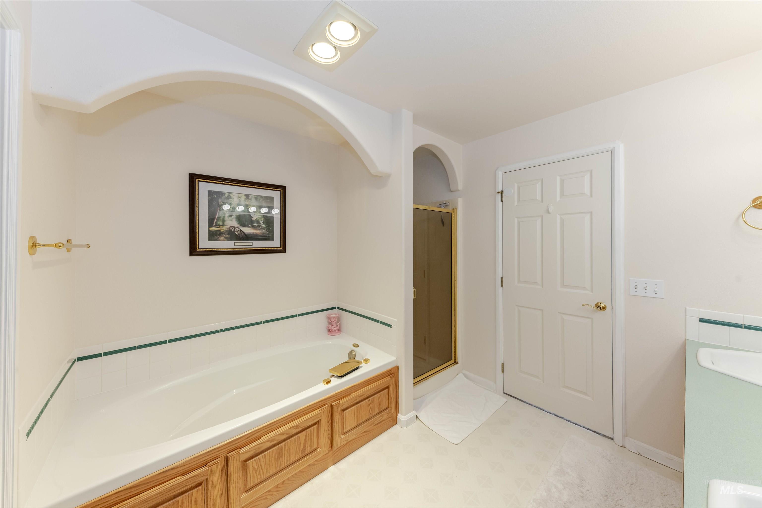 331 Reservoir Drive Lewiston, ID 83501 - Photo 22 of 42 Full bathroom featuring vanity, a bath, and a shower stall