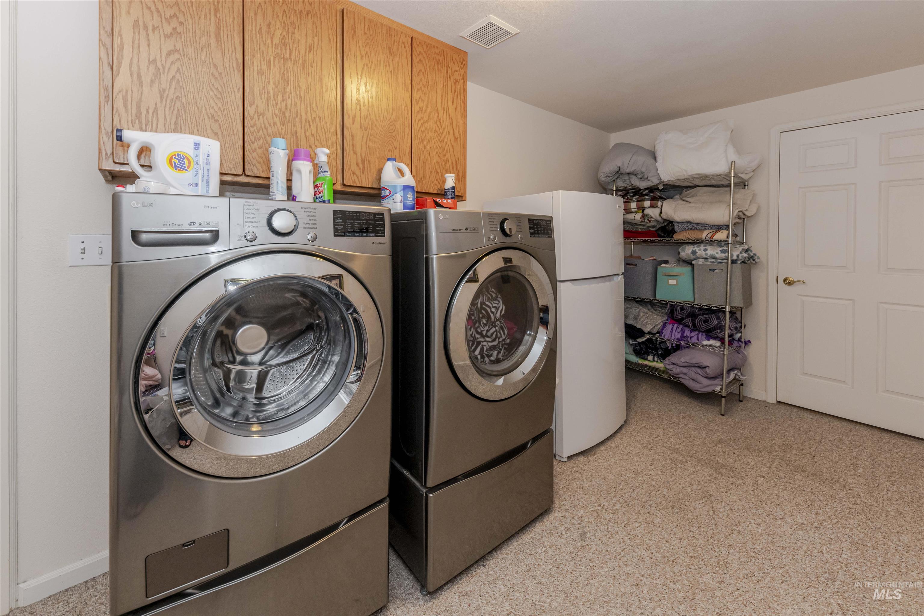 331 Reservoir Drive Lewiston, ID 83501 - Photo 25 of 42 Washroom with washing machine and clothes dryer and cabinet space