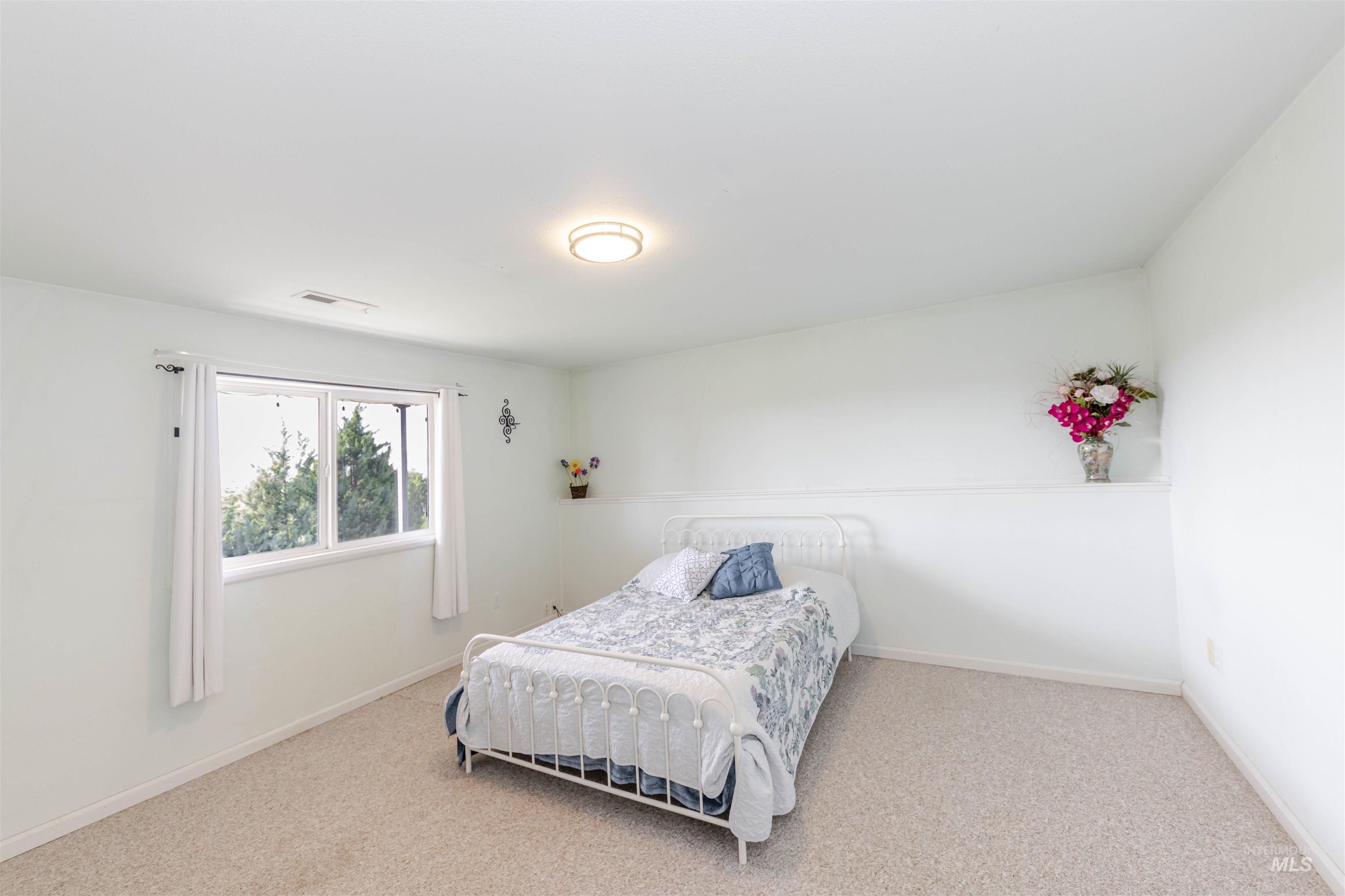 331 Reservoir Drive Lewiston, ID 83501 - Photo 28 of 42 Carpeted bedroom featuring baseboards