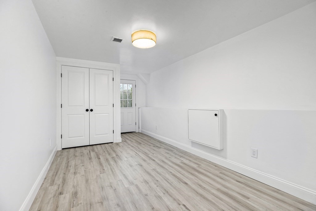 216 Grove Street Randolph, MA 02368 - Photo 26 of 34 wooden floor in an empty room