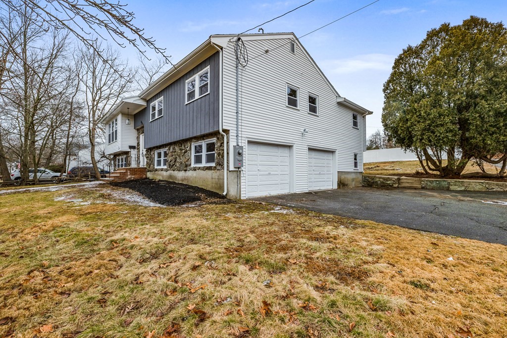 216 Grove Street Randolph, MA 02368 - Photo 32 of 34 a front view of a house with a yard