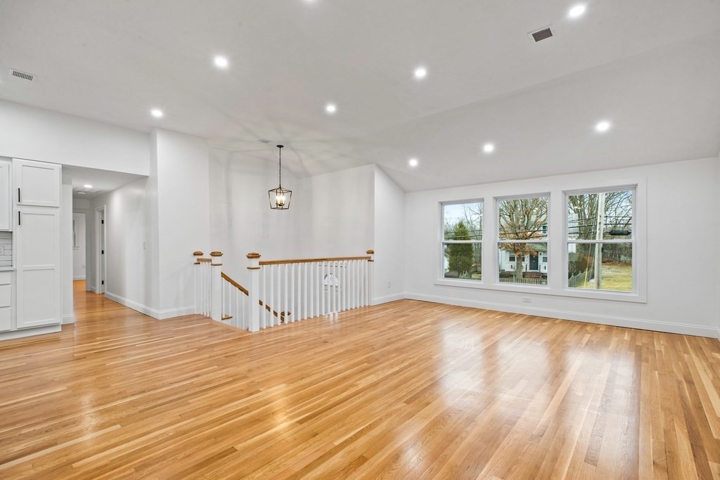 216 Grove Street Randolph, MA 02368 - Photo 5 of 34 a view of empty room with wooden floor and windows