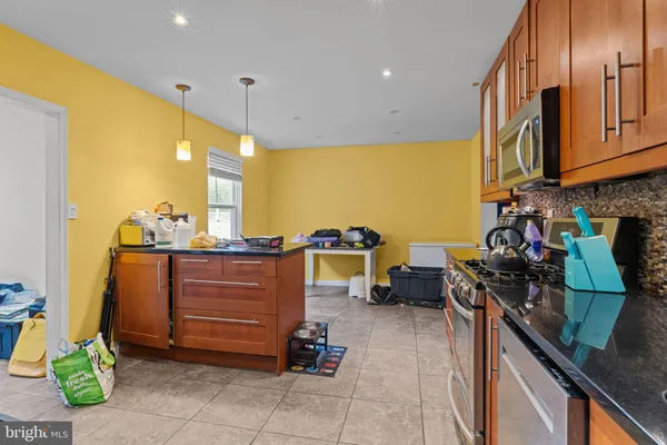 a kitchen with a sink appliances and cabinets