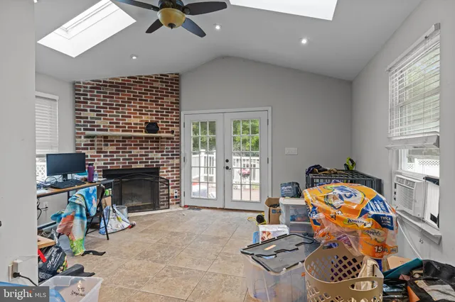 a very nice looking bedroom with a bed and a chandelier