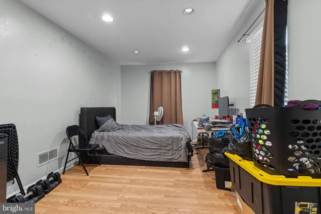 a bedroom with a bed and a table