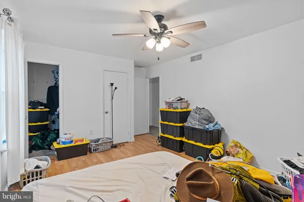 a bedroom with bed and a chandelier