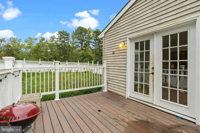 a view of a deck with a table and chairs and wooden floor