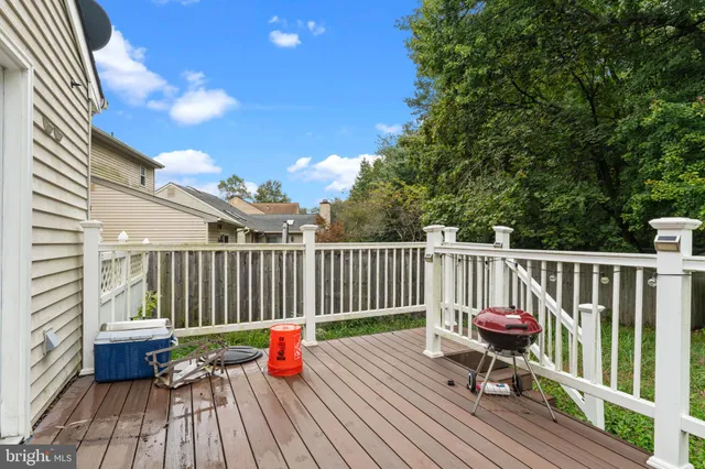 a view of balcony with wooden floor and outdoor seating