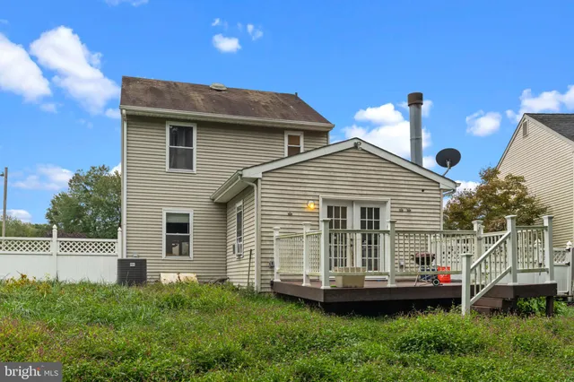 a view of a house with a backyard and porch