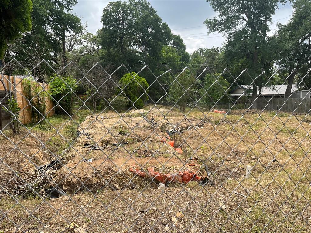 4621 Menchaca Road Austin, TX 78745 - Photo 3 of 7 a backyard of a house with a large tree