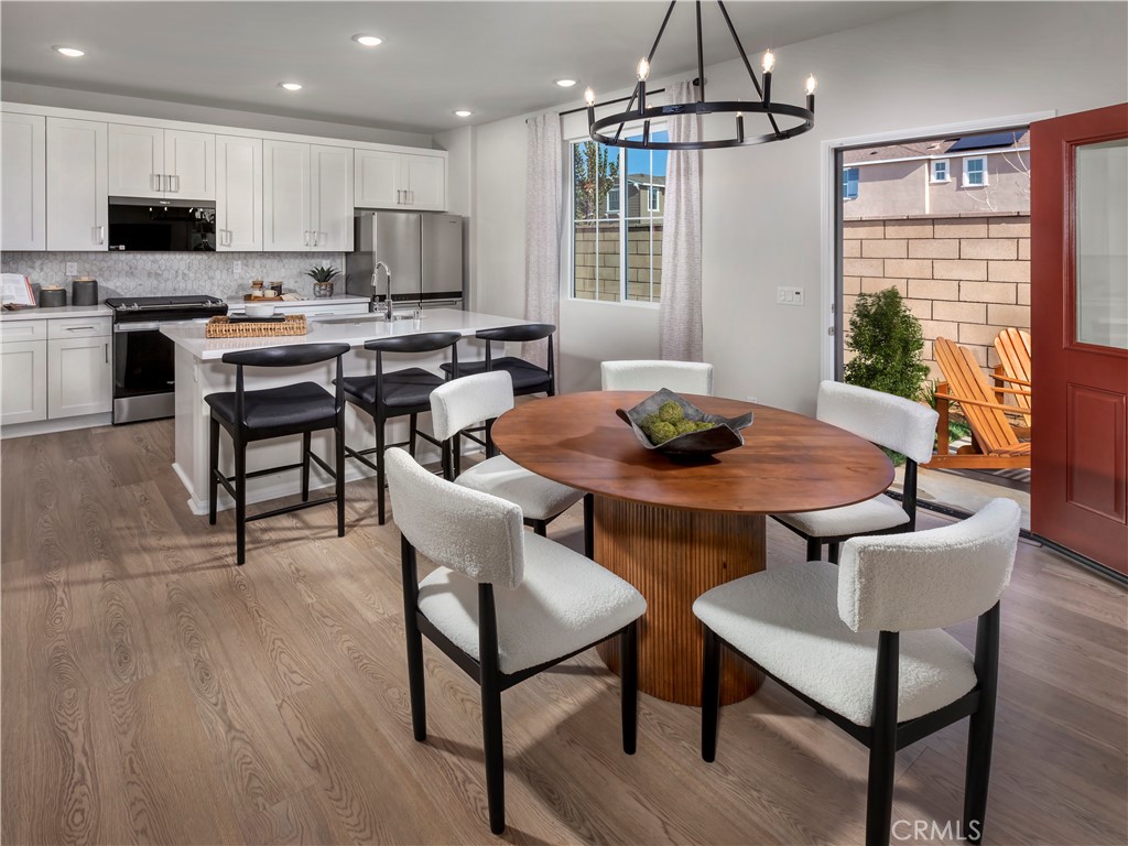 28320 Via Moscotel Temecula, CA 92591 - Photo 4 of 14 a view of a dining room with furniture window and wooden floor
